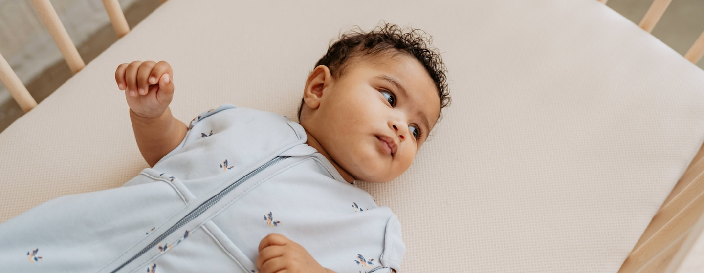 newborn baby in a piep sleeping bag